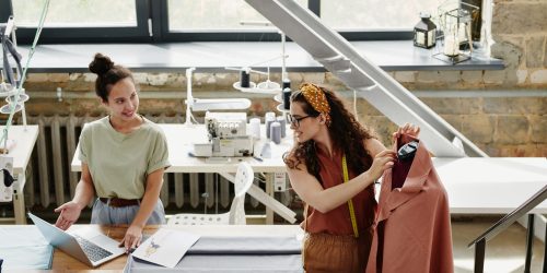 happy-young-designer-of-fashion-showing-her-colleague-new-models-scaled-1.jpg happy-young-designer-of-fashion-showing-her-colleague-new-models-scaled-1.jpg